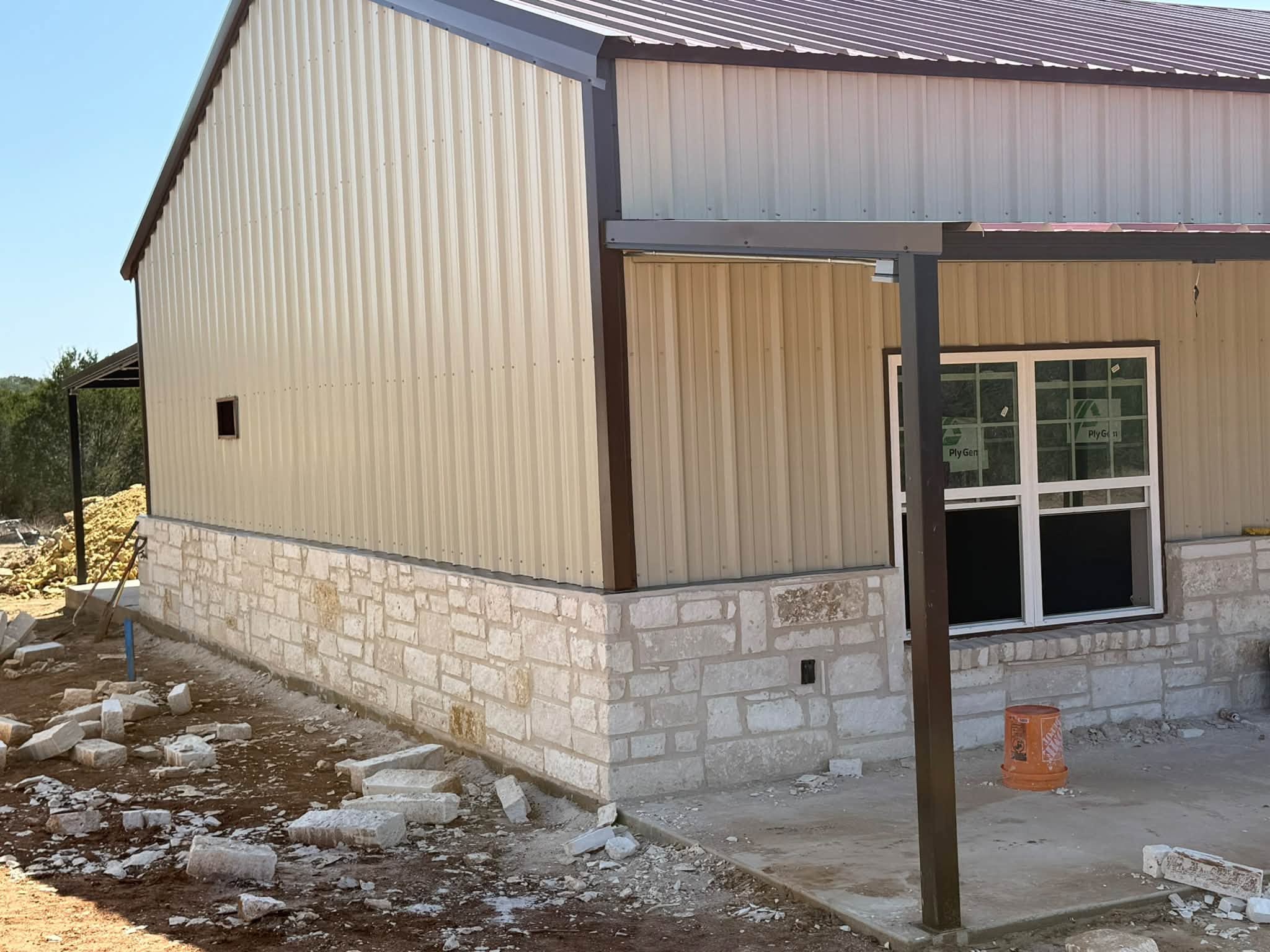 Stone wainscot installed by WhiteStone Construction around Rick Toumbs' garage in Evant, Texas