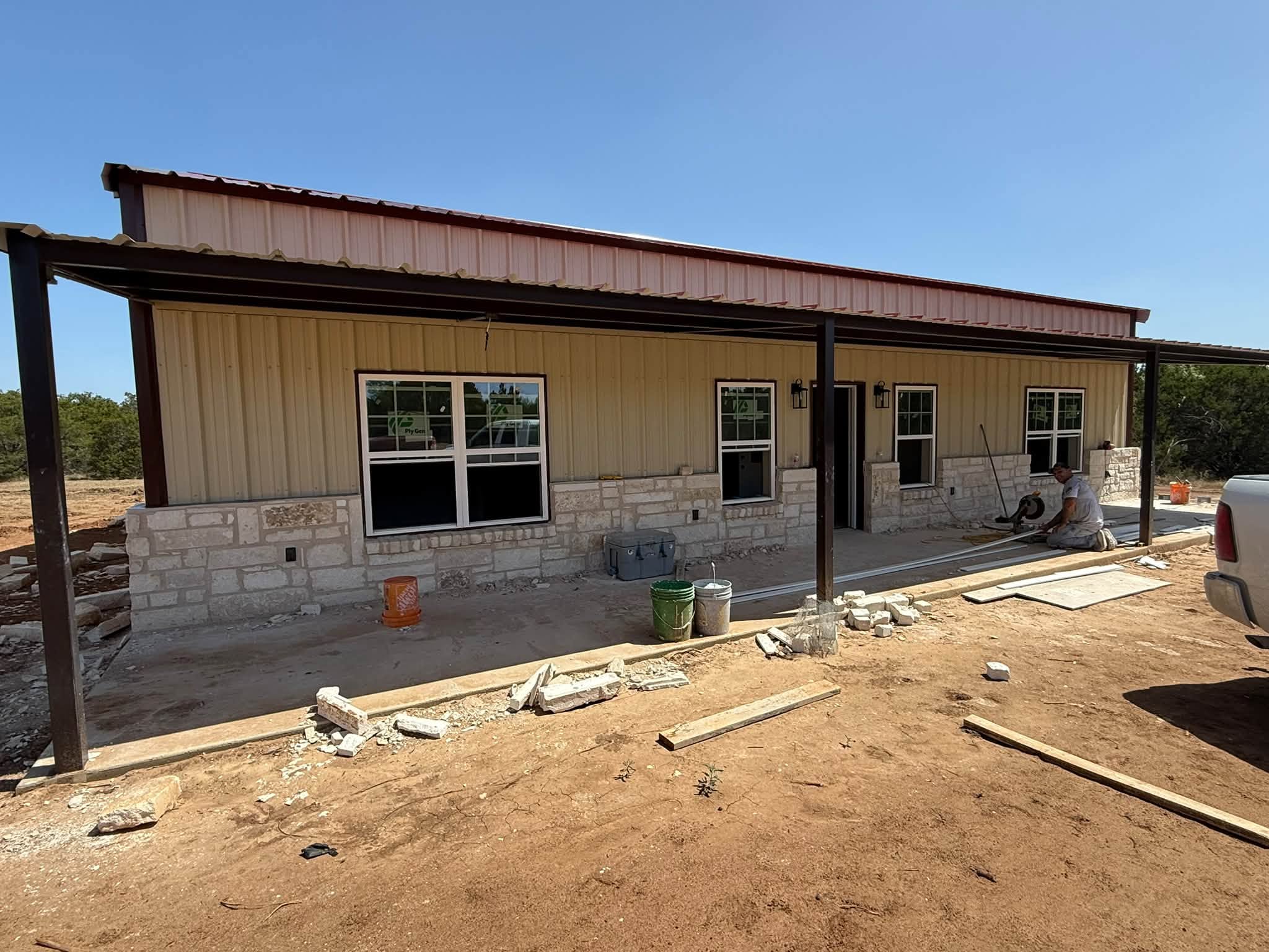 Stone wainscot installed by WhiteStone Construction around Rick Toumbs' house in Evant, Texas